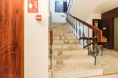 a stairway in a building with a stair case at Sakthi Grand in Erode
