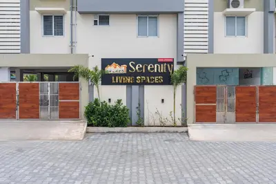 a building with a sign that reads gemini luxury suites at Everest Serenity Service Apartment in Pīlamedu
