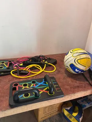 a shelf with a bunch of scissors and a ball at Kanthalloor puregolds in Kanthalloor