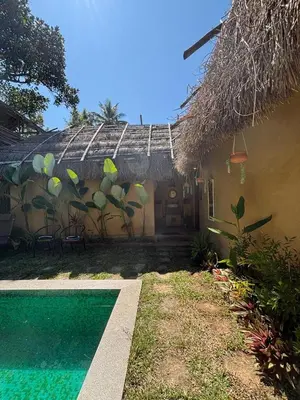 a house with a swimming pool in front of it at Earthen Pool Villa! Redefining Luxury! in Marayoor