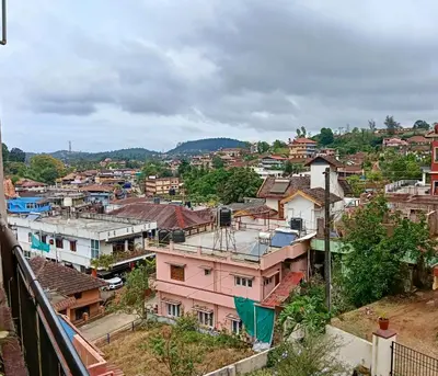 an overhead view of a city with buildings at Coorg villas & homes in Madikeri
