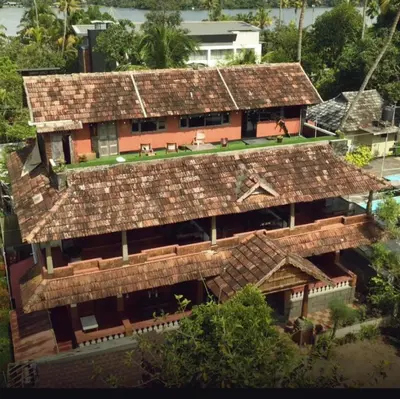 an aerial view of a house with a roof at Kottaram Heritage in Pallipuram