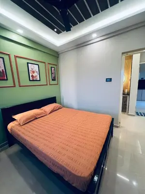 a bedroom with a large bed in a room at Kvm RIVER VIEW - 2bhk in Palakkad