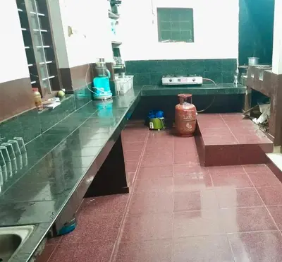 a kitchen with a counter top and a sink at Dua farms in Sultan Bathery