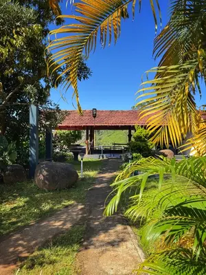 a path leading to a pavilion in a park at Rafters Retreat Coorg - The Riverside Homestay in Srimangala