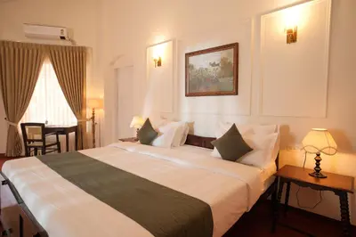 a bedroom with a large bed in a room at The Hundred House by Kisah Stays in Ambalavayal