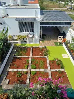 a garden on the roof of a house at AR Homes in Coimbatore