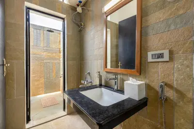 a bathroom with a sink and a shower at amã Stays & Trails - Highland Breeze , Coimbatore in Coimbatore