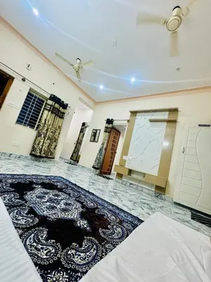 a living room with a rug on the floor at Flats in city center, next to NEXUS MALL in Mysore