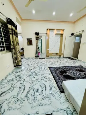 a room with a marble floor with a bed at Flats in city center, next to NEXUS MALL in Mysore