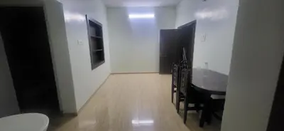 a dining room with a table and chairs in a room at Serene Steps Orion in Coimbatore