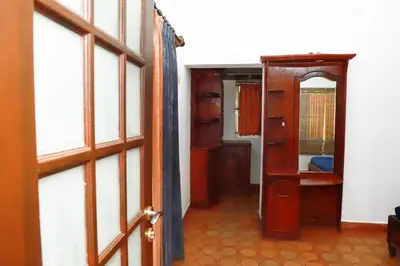 an open door to a room with a hallway at Rainbow Homestay Wayanad in Kalpetta