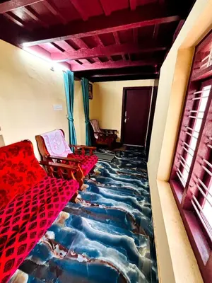 a room with a stream painted on the floor at Edwin and Edrin Service Villa in Wayanad