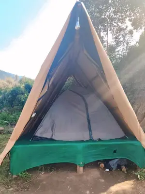 a blue and green tent with the door open at Daddy's MAD house in Kottakamboor