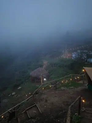 a view of a hill with lights on it at Daddy's MAD house in Kottakamboor