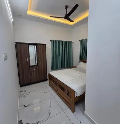 a bedroom with a bed and a ceiling fan at The Paul Residence