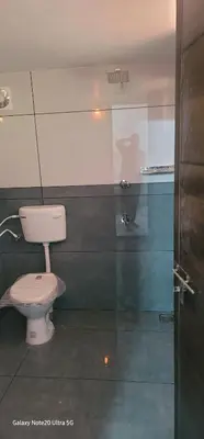 a bathroom with a toilet in a room at The Paul Residence