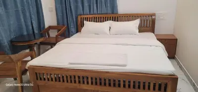 a bedroom with a large bed with white sheets at The Paul Residence