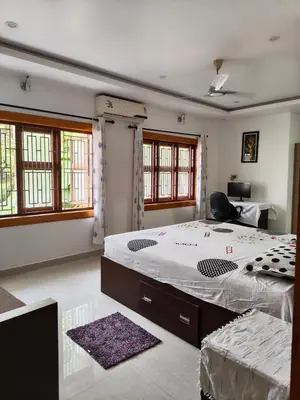 a bedroom with a large bed and a desk at Retreat Rivera where Serenity Meets the River in Green Island