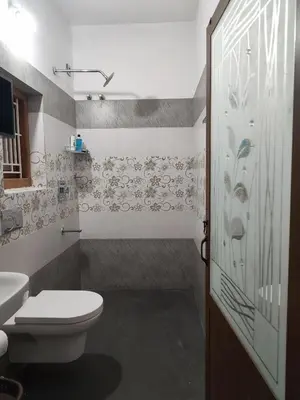 a bathroom with a toilet and a sink at Retreat Rivera where Serenity Meets the River in Green Island