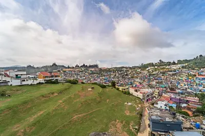 an aerial view of a city with houses and buildings at Treebo Lumino Crown, 850 Meters From Ooty Lake in Ooty