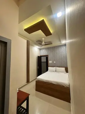 a bedroom with a bed in a room at MK Residency Calicut near Baby Memorial Hospital in Kozhikode