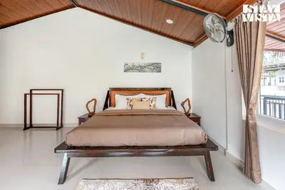 a bedroom with a bed and a window at StayVista at Hermitage 4BR - Boutique Stay - Relax in Nature in Irpu