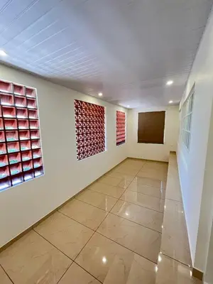 a room with paintings on the walls and a floor at Aagneyam Grand Resort in Kozhikode