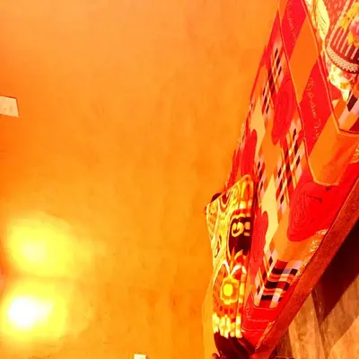 a close up of the side of a red box at Mud bees resort in Kanthalloor
