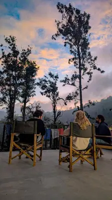a couple of chairs sitting on top of a patio at Mad & Nomad Backpackers Hostel in Coonoor