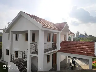 a model of a house with a roof at Lush Green View Cottage 3BH in Ooty