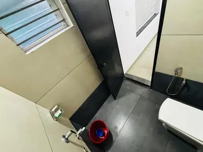 an overhead view of a bathroom with a toilet and sink at Merrat Regency in Trichūr
