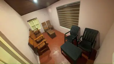 an overhead view of a room with chairs and a window at Bucolic Resort in Panamaram