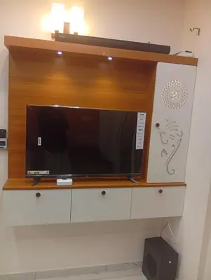 a microwave sitting on top of a cabinet at Gurunandanam-Fully furnished Deluxe Apartment East Nada Guruvayur in Guruvāyūr