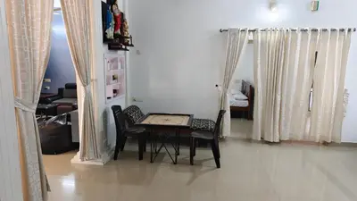 a dining room with a table and chairs in a room at Havenza Homestayz in Athirappilly