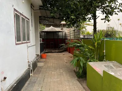 an entrance to a building with an open gate at Tulips villa in Mānantoddy