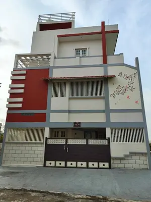 a tall building with a red and white at Galasy in Narasimharaja Puram