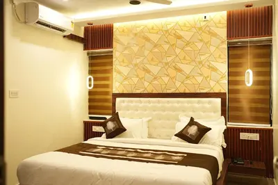 a bedroom with a large bed in a room at Elite Group Mysore in Mysore