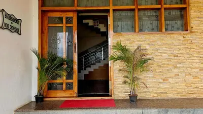 an entrance to a building with a staircase in it at Corcordium by ssr in Bilikere