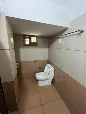a bathroom with a toilet in a room at Idachirakkal homestay in Palghat