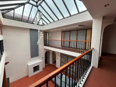 an empty building with a skylight in a building at Burnside Cottage in Kotagiri