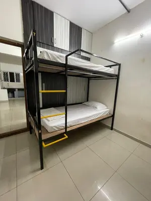 a couple of bunk beds in a room at AAKI Comforts in Mysore