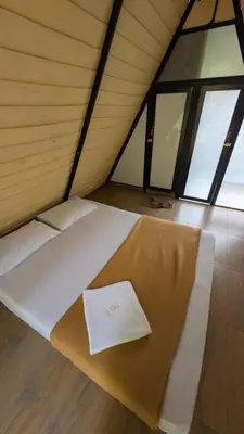 a bed in a room with a napkin on it at Vihara Inn Resort in Vayittiri