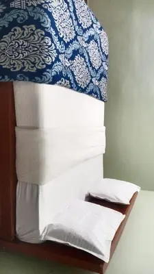 a bunk bed with a stack of sheets and towels at RS Hollidays ooty in Ooty