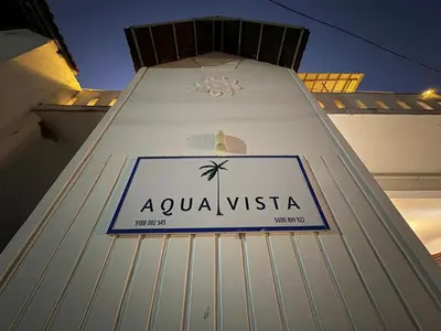 a sign on the side of a building at Aqua Vista beach home's in Cochin