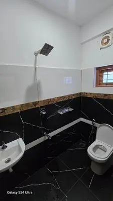 a bathroom with a toilet and a sink at Azhagumail Honey Resort Kanthalloor in Kanthalloor