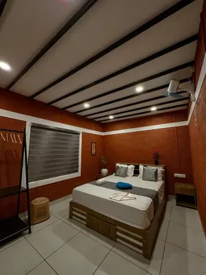 a bedroom with a large bed in a room at Rockview in Kalpetta