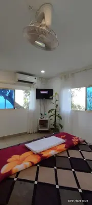 a bedroom with a large bed and a ceiling at Ponkunnu Farmstay and Resorts - Emerald - The Tree House - First Floor in Bālūssheri