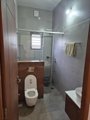 a small bathroom with a toilet and a sink at Prabhu Villla Upper Deck in Perumbavoor