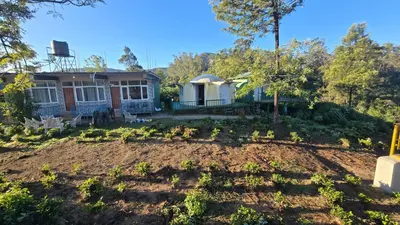 a garden in front of a house at Silver lake nature escape in Ooty